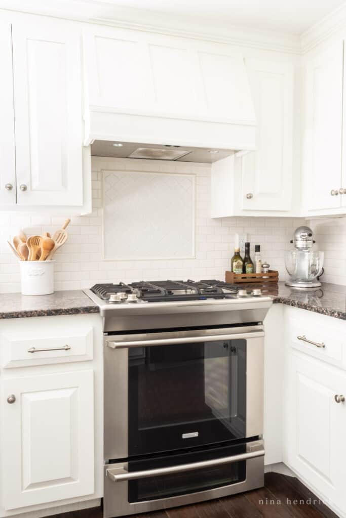 DIY Range hood cover with white painted cabinets