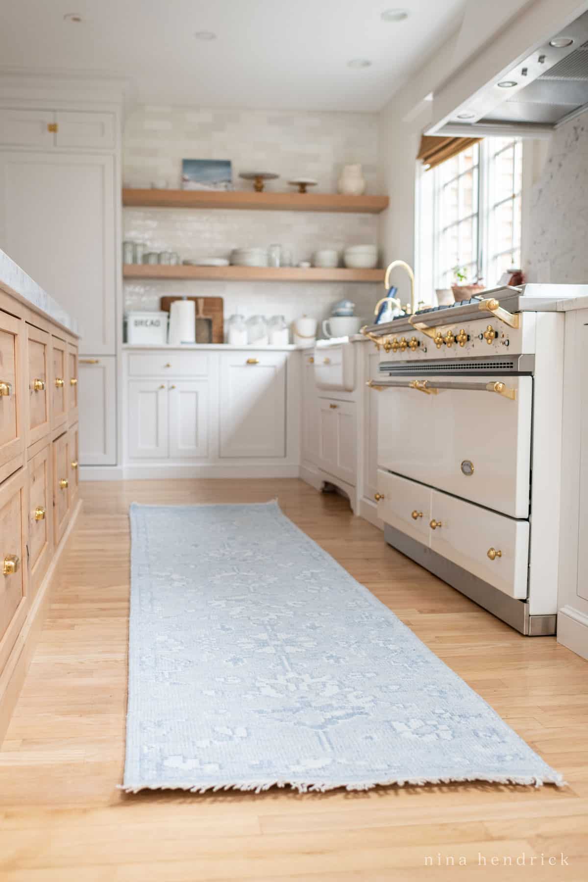 Kitchen with blue runner rug