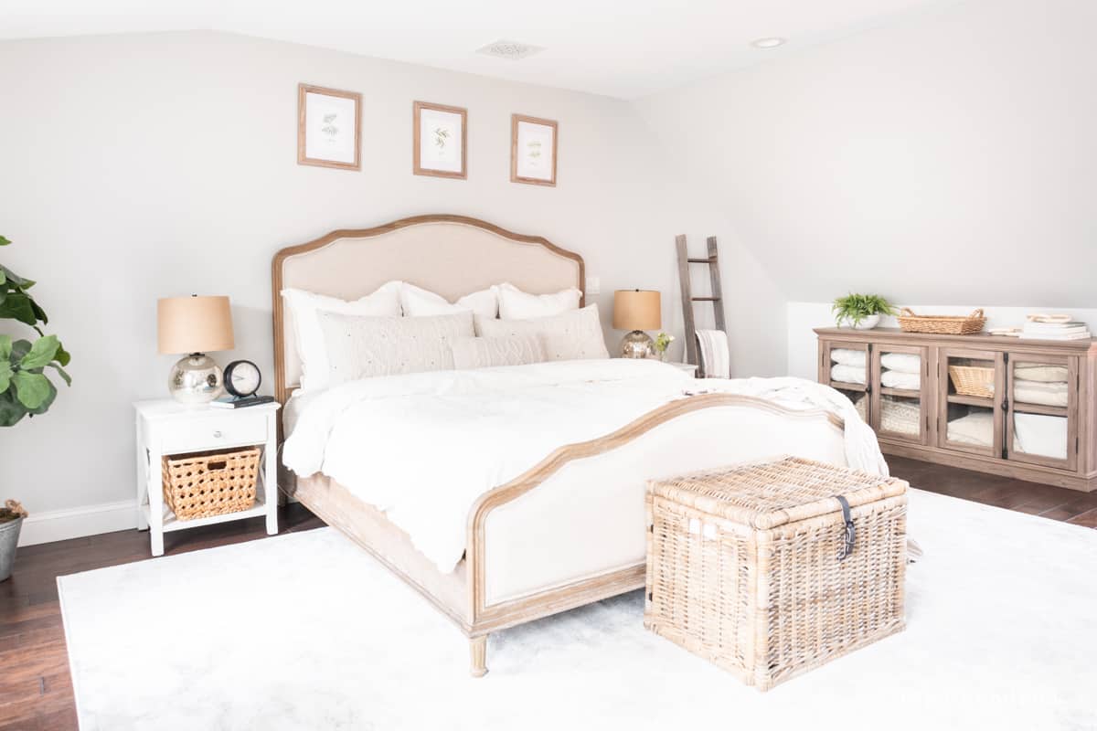 Neutral bedroom with cozy linens and a 9x12' size area rug. 