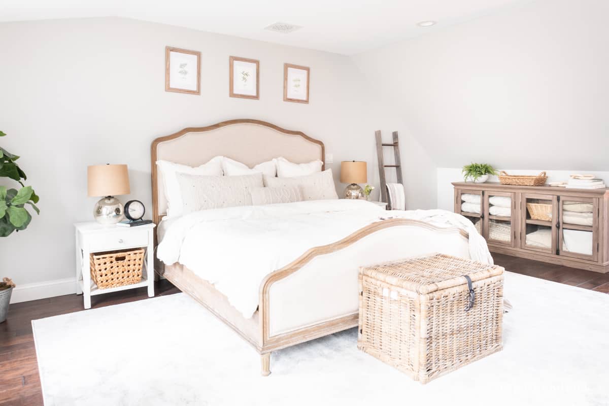 Neutral bedroom with cozy linens and a 9x12' size area rug.