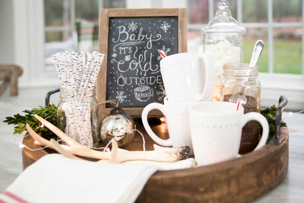 Hot chocolate tray centerpiece with white mugs
