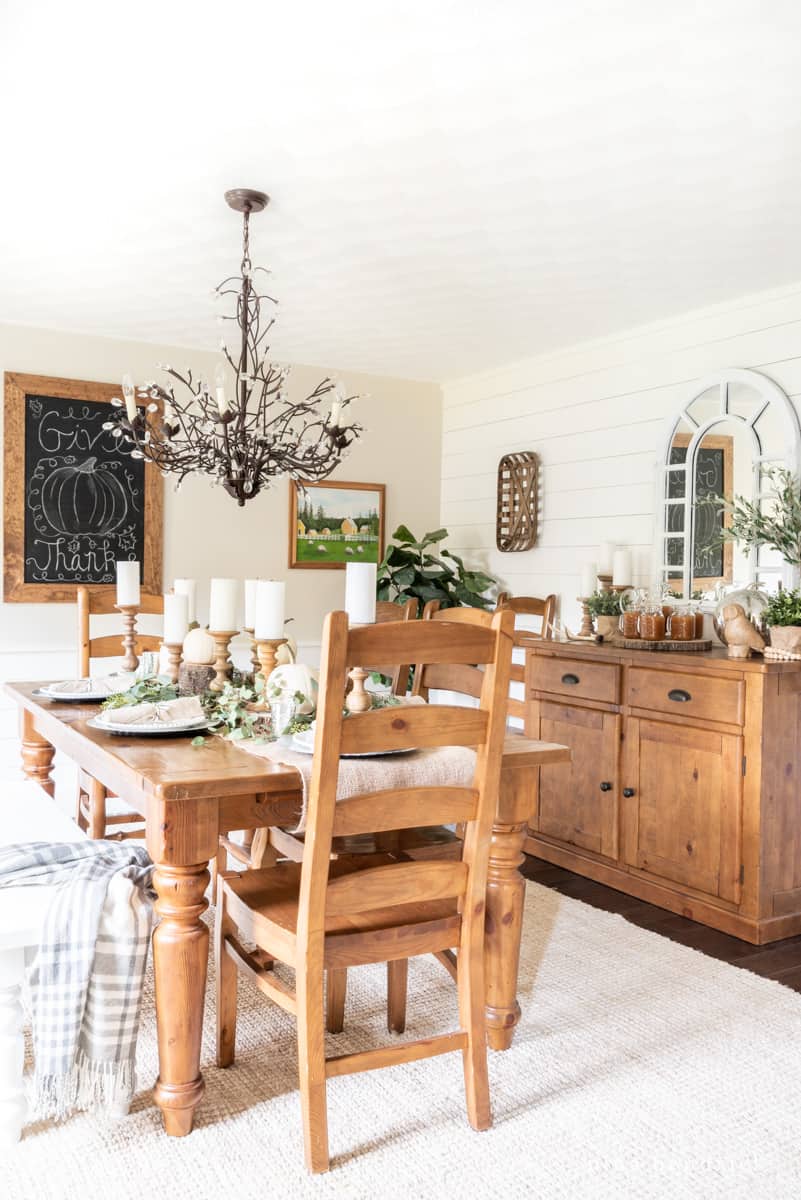 rustic Thanksgiving dining room with warm wood tones and a tablescape