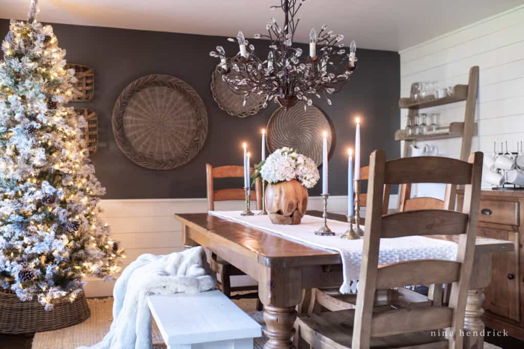 Dark dining room with Christmas tree and hydrangeas