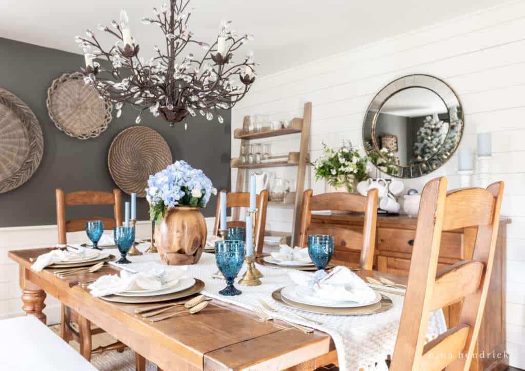 Blue tablescape for Christmas with hydrangeas and colbalt glassware