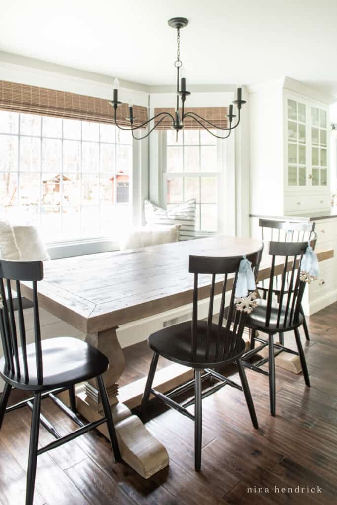 Breakfast Nook with windows and ornaments on black chairs | Nina Hendrick Home