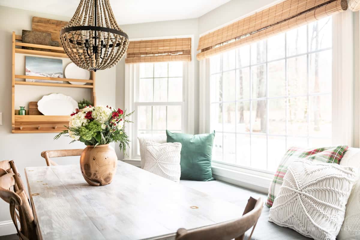 Cozy breakfast nook with basic holiday decor in red and green