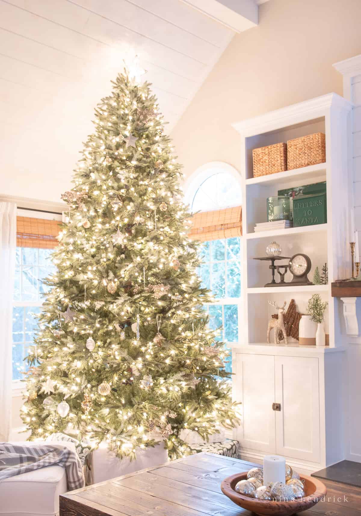 Simple Christmas tree decor with neutral ornaments and shimmering lights