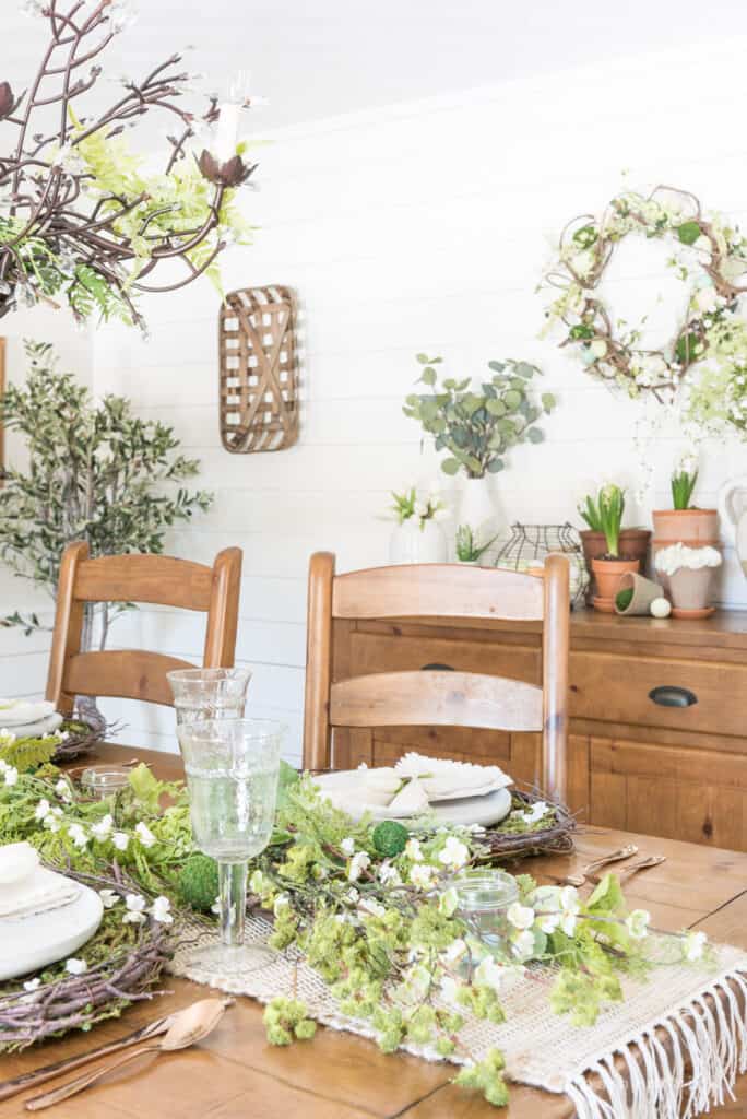 Spring tablescape decorating tips and ideas with a lot of greenery and flowers