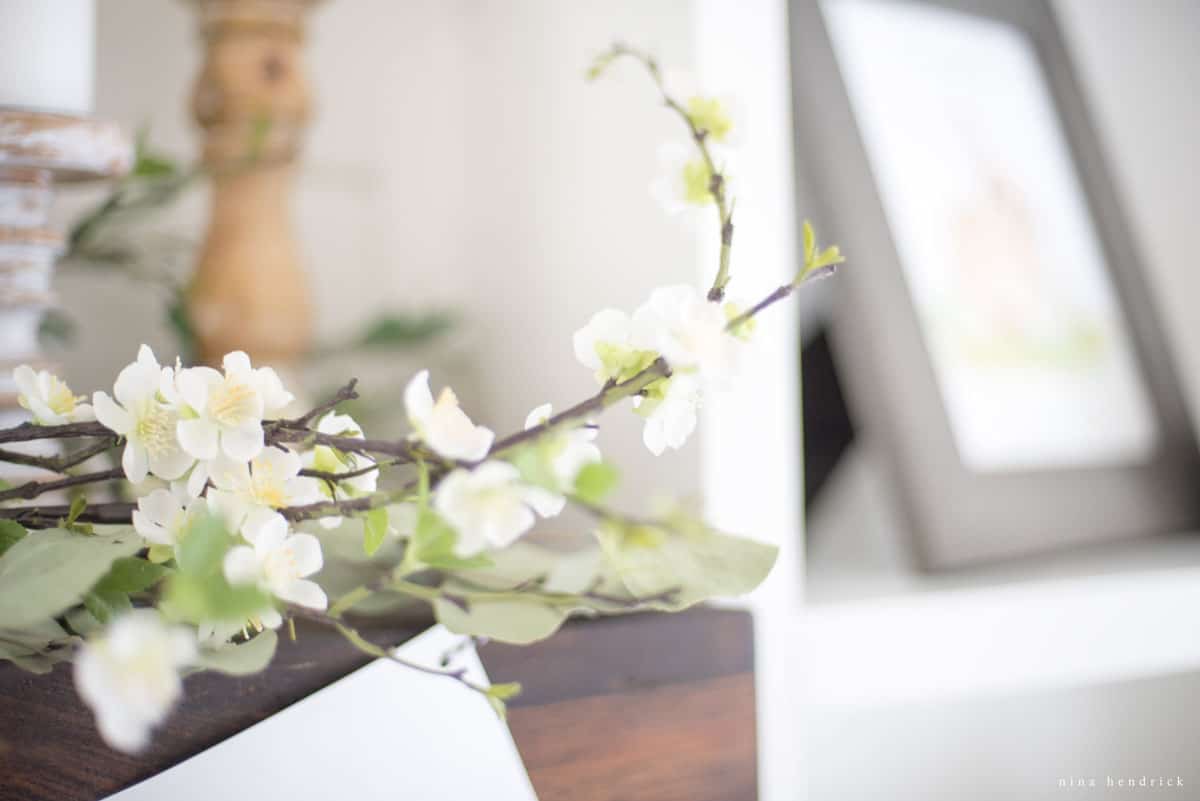 Spring blossoming branch on the mantel