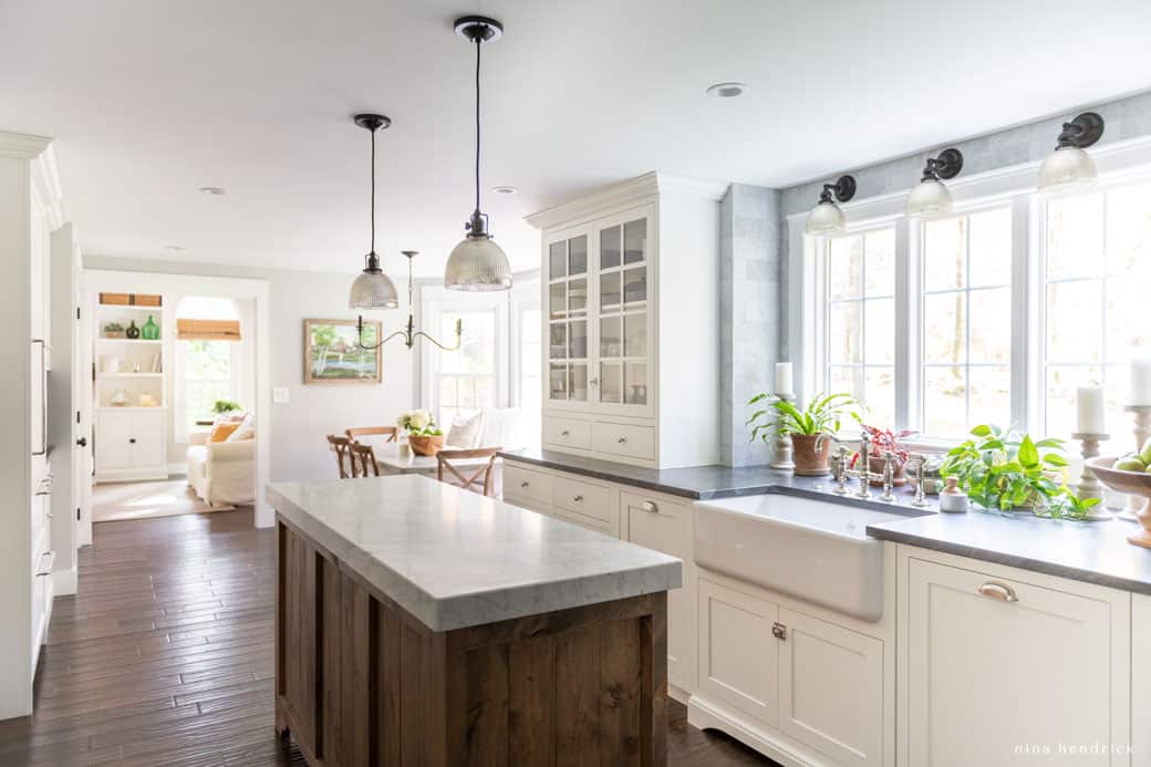 Simple and clean kitchen with white cabinets and wood tones