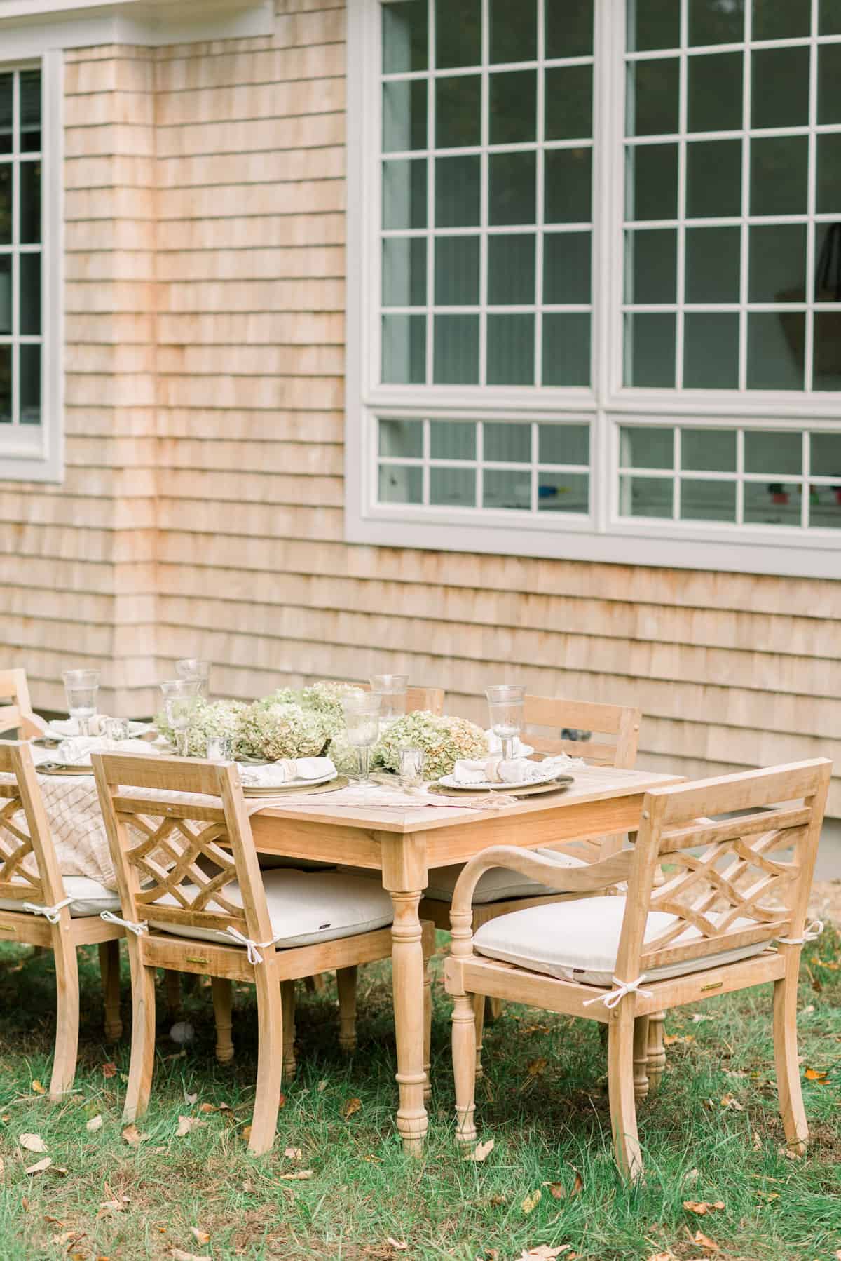 Outdoor dining area with teak table and chairs
