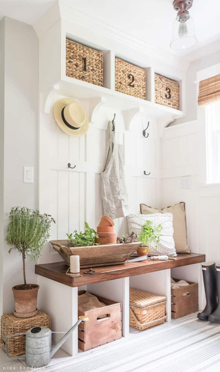 Mudroom repurposed as a potting bench with garden summer decor