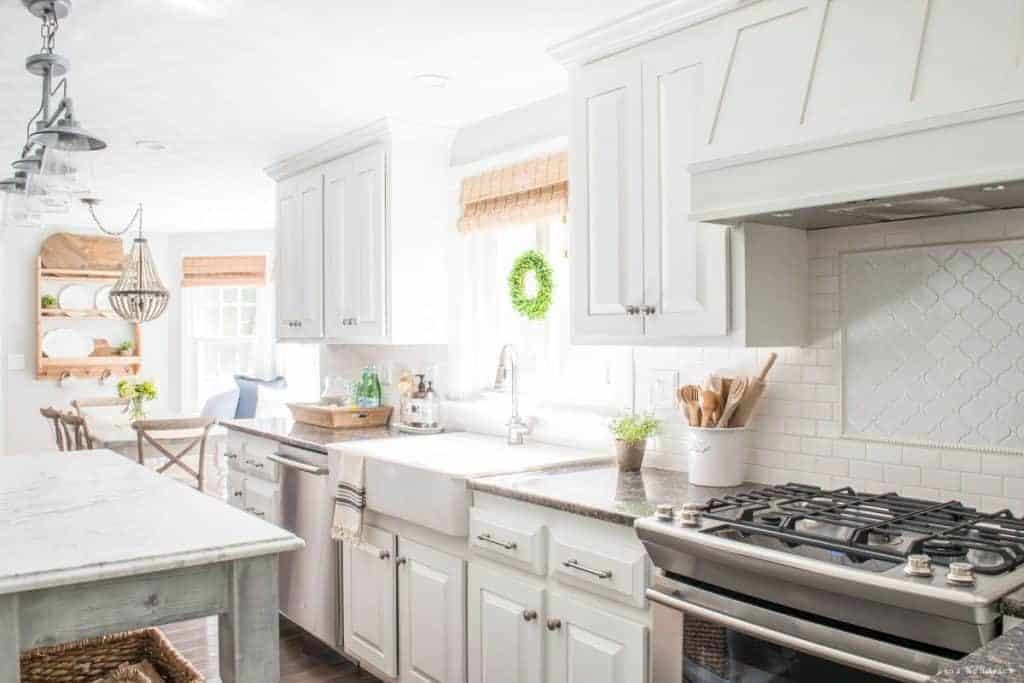 Sunny kitchen with white painted oak cabinets