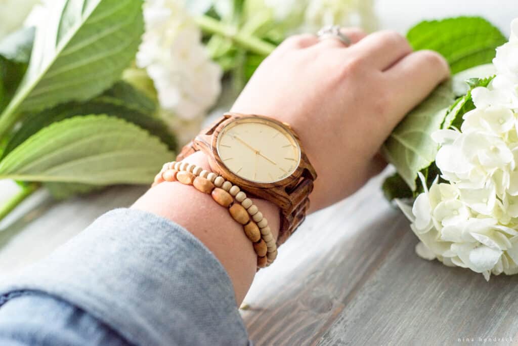 arm with watch and flower