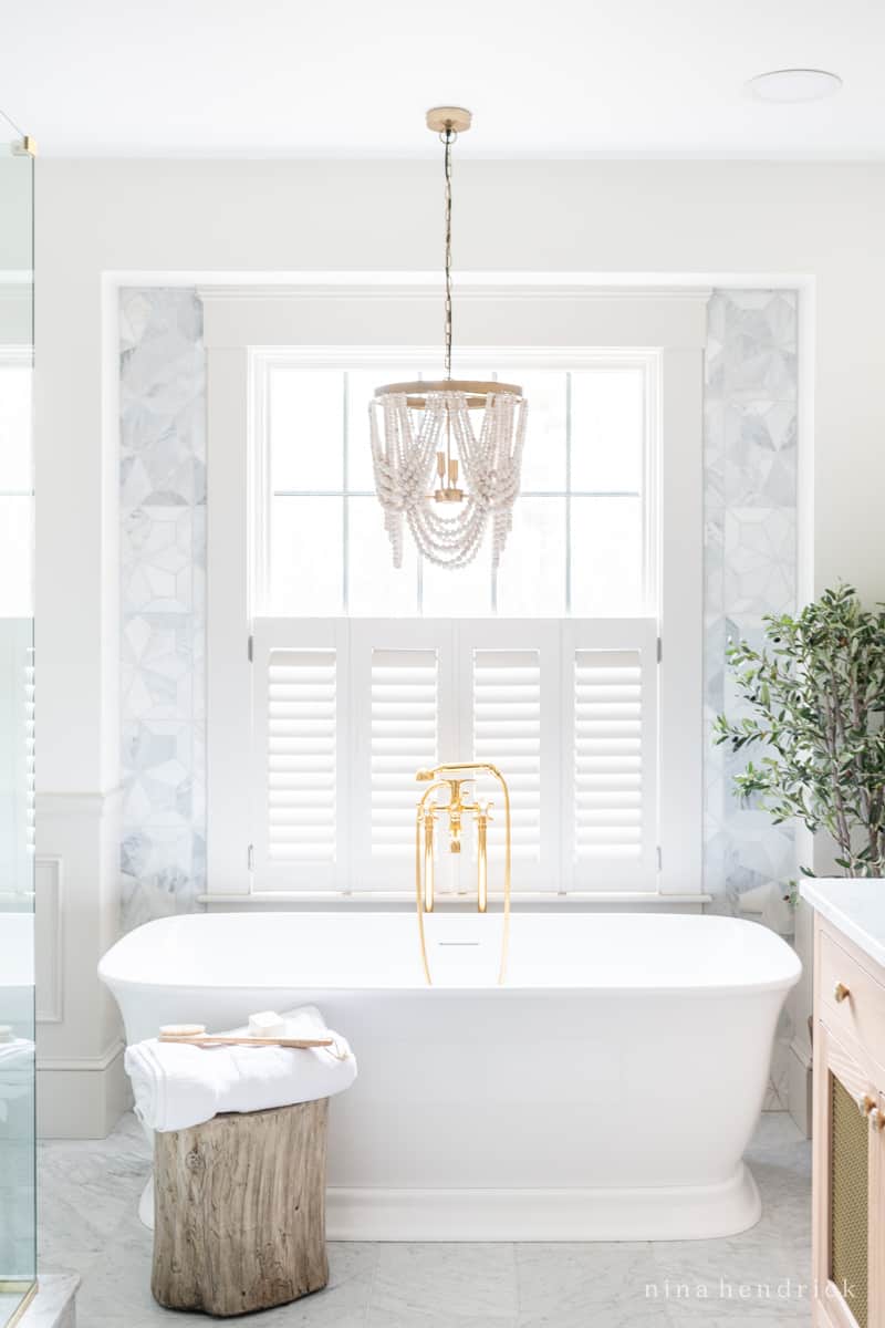 Freestanding Bathtub with wood bead chandelier