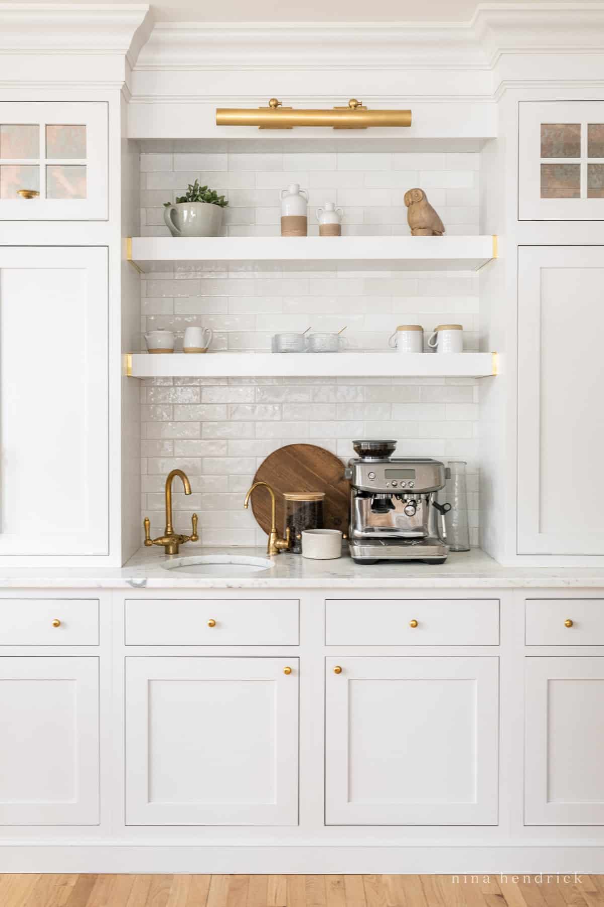 Coffee bar with espresso machine and bar sink in a timeless kitchen.