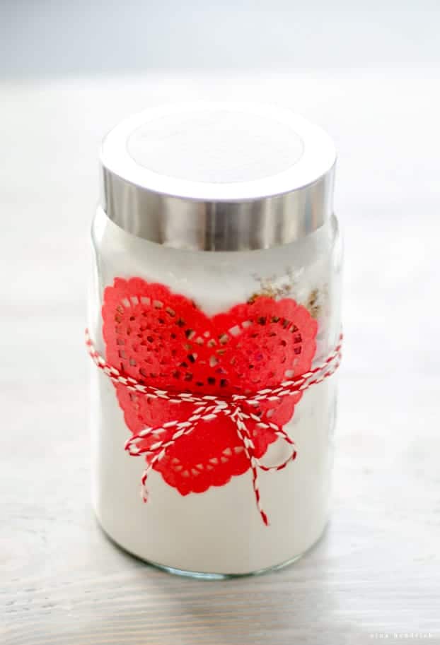 diy cookie mix in a jar gift with red paper doily and twine