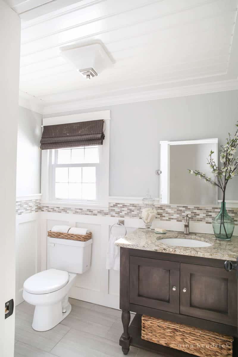 Powder bathroom with board and batten with a tile border