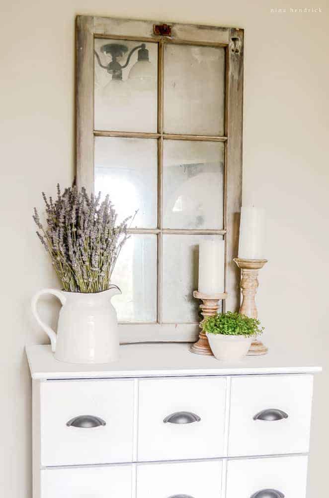 Barn Window Mirror | Learn how to transform a barn window to an antique mirror using looking glass spray paint. This is a great idea for all of those old windows you may have lying around!