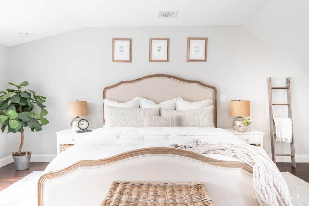 Bedroom with Respose Gray walls and cream bedding