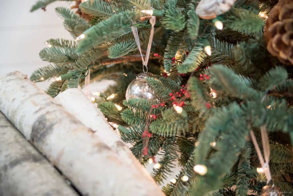 Birch logs below the Christmas tree