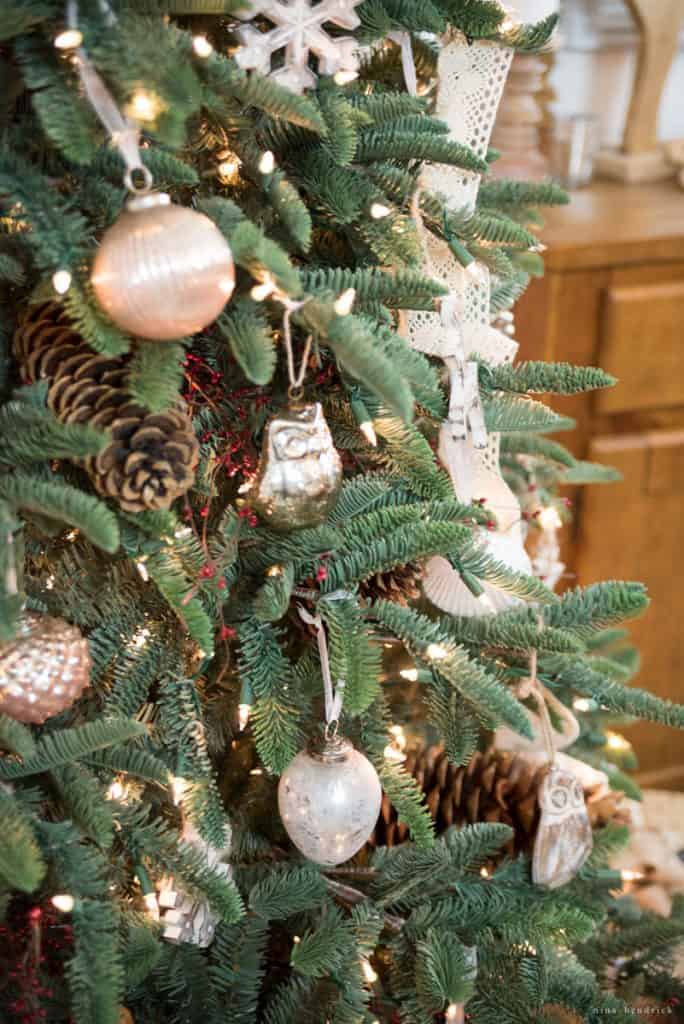 mercury glass ornaments and decorations on a woodland themed Christmas tree