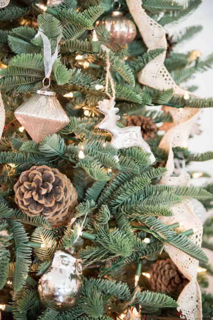 Pine cones and mercury glass ornaments with lace