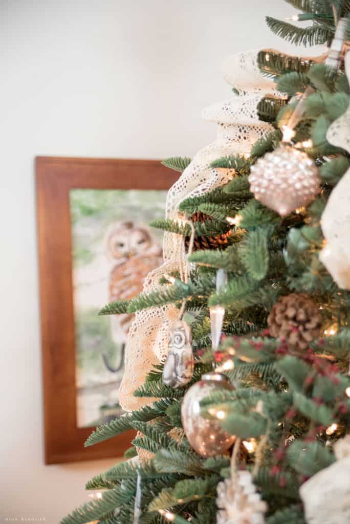 Woodland Inspired Christmas Tree in front of a rustic owl painting