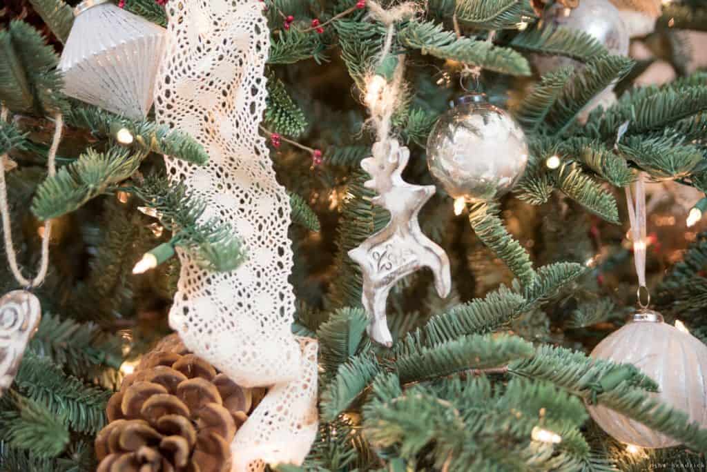 festive ornaments and greenery with woodsy touches