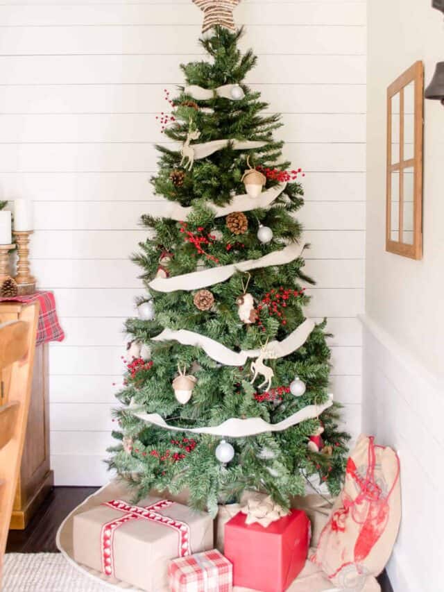 A rustic christmas tree in a dining room.