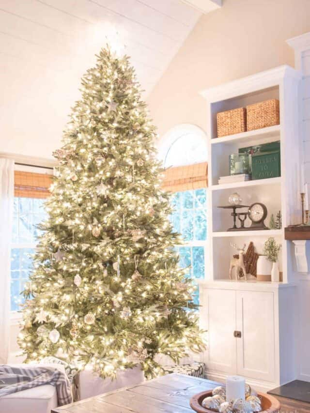 A white christmas tree in a living room.