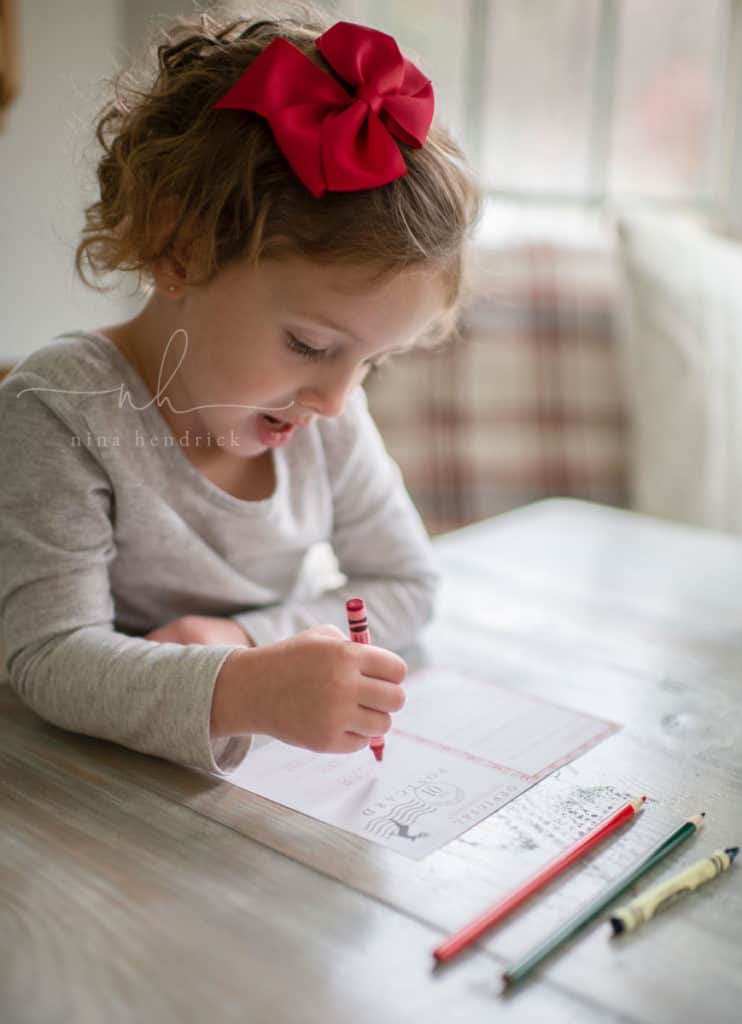 little girl writing a letter to santa